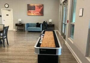 image of a very new and professional-looking game and social room as part of a process addiction treatment program facility