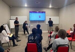 group session at substance abuse treatment center being led by experienced behavioral health therapists is technological classroom