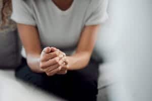 Hands of a person learning about the benefits of an alcohol detox center